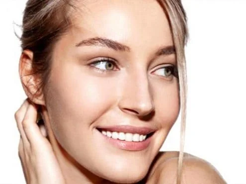 smiling woman with clean, bright skin